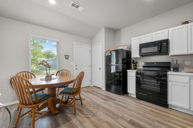 229 Baldwin Dr, Beebe, AR 72012 - dining room with vaulted ceiling and light wood-style flooring