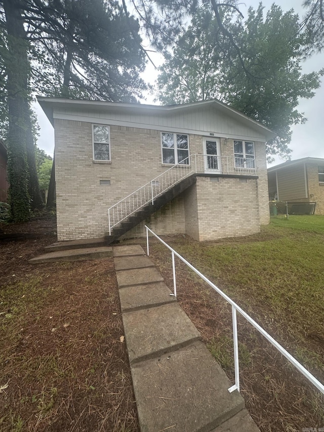 2406 N Berkley Dr, North Little Rock, AR 72118 - view of front facade featuring brick siding and stairs