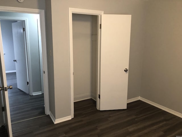 6 Bryan Keith Ct, Little Rock, AR 72206 - unfurnished bedroom featuring dark wood finished floors, baseboards, and a closet