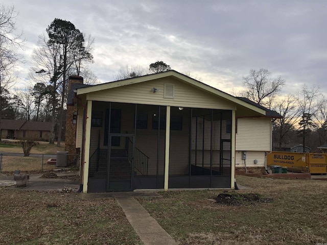 6 Bryan Keith Ct, Little Rock, AR 72206 - back of house with a sunroom, a chimney, and cooling unit