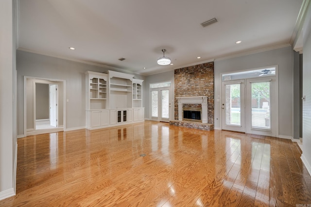 378 Pippinpost, Conway, AR 72034 - unfurnished living room featuring a fireplace, light wood finished floors, baseboards, crown molding, and recessed lighting