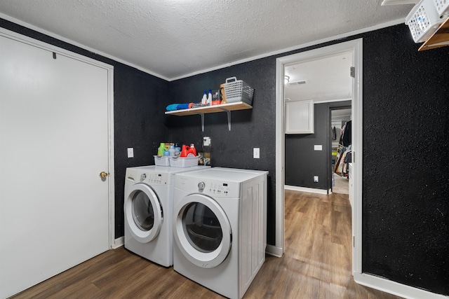 508 W Bell, Sheridan, AR 72150 - laundry area with separate washer and dryer, wood finished floors, a textured ceiling, and a textured wall