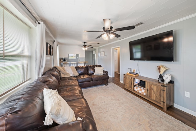 508 W Bell, Sheridan, AR 72150 - living area featuring crown molding, wood finished floors, baseboards, and a ceiling fan