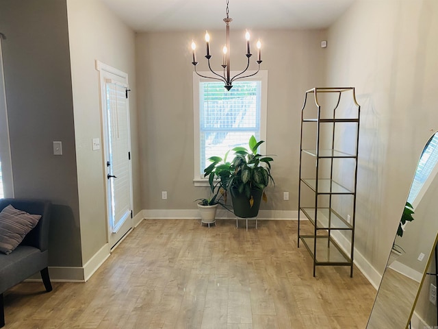 5104 Peace Ln, Alexander, AR 72002 - foyer entrance featuring healthy amount of natural light, light wood-style flooring, a chandelier, and baseboards