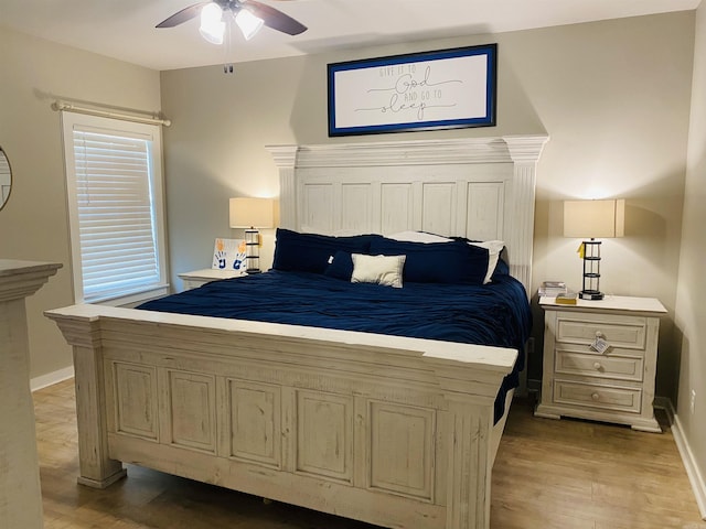 5104 Peace Ln, Alexander, AR 72002 - bedroom featuring wood finished floors, baseboards, and a ceiling fan