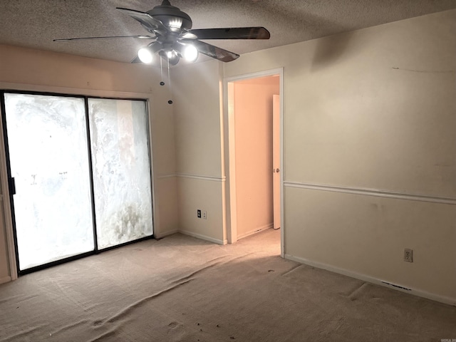 13 Page Cv, Maumelle, AR 72113 - empty room featuring ceiling fan, light colored carpet, a textured ceiling, and baseboards