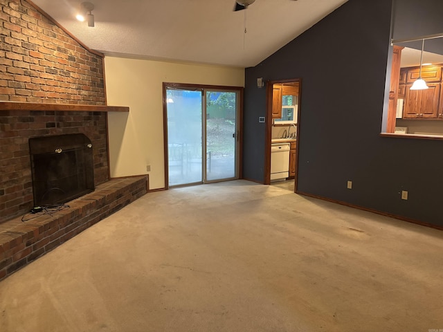13 Page Cv, Maumelle, AR 72113 - unfurnished living room featuring vaulted ceiling, ceiling fan, light colored carpet, a brick fireplace, and baseboards