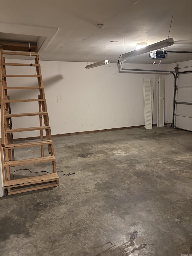 13 Page Cv, Maumelle, AR 72113 - garage featuring a garage door opener and baseboards