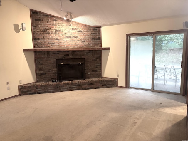 13 Page Cv, Maumelle, AR 72113 - unfurnished living room with lofted ceiling, a fireplace, and carpet