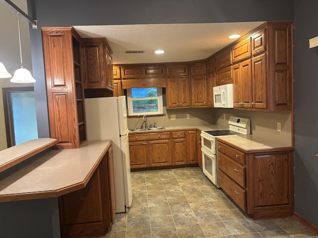 13 Page Cv, Maumelle, AR 72113 - kitchen featuring white appliances, a sink, a peninsula, light countertops, and recessed lighting
