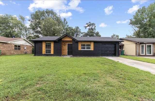 610 E 33rd Ave, Pine Bluff, AR 71601 - ranch-style home with driveway, an attached garage, brick siding, and a front lawn
