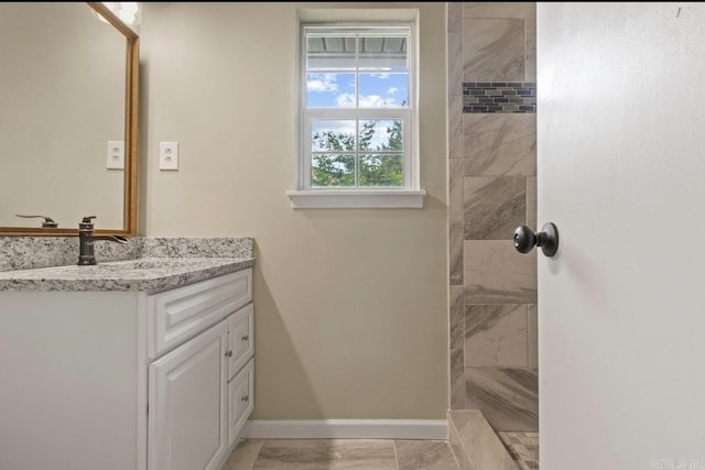 610 E 33rd Ave, Pine Bluff, AR 71601 - bathroom with vanity, walk in shower, and baseboards
