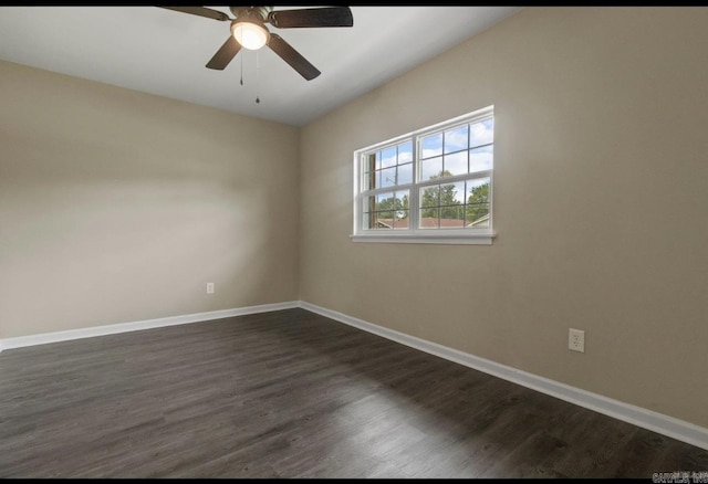 610 E 33rd Ave, Pine Bluff, AR 71601 - unfurnished room featuring baseboards, dark wood-style flooring, and a ceiling fan