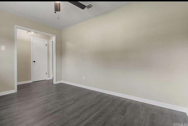 610 E 33rd Ave, Pine Bluff, AR 71601 - unfurnished room with ceiling fan, dark wood-style floors, and baseboards