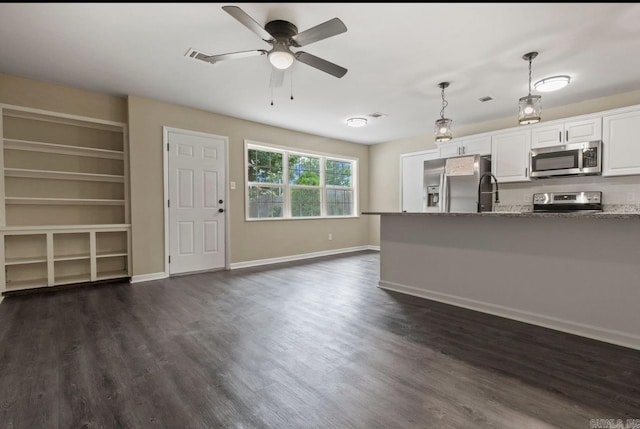 610 E 33rd Ave, Pine Bluff, AR 71601 - unfurnished living room with ceiling fan, dark wood-type flooring, and baseboards
