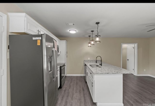 610 E 33rd Ave, Pine Bluff, AR 71601 - kitchen with stainless steel appliances, a sink, dark wood finished floors, white cabinetry, and baseboards