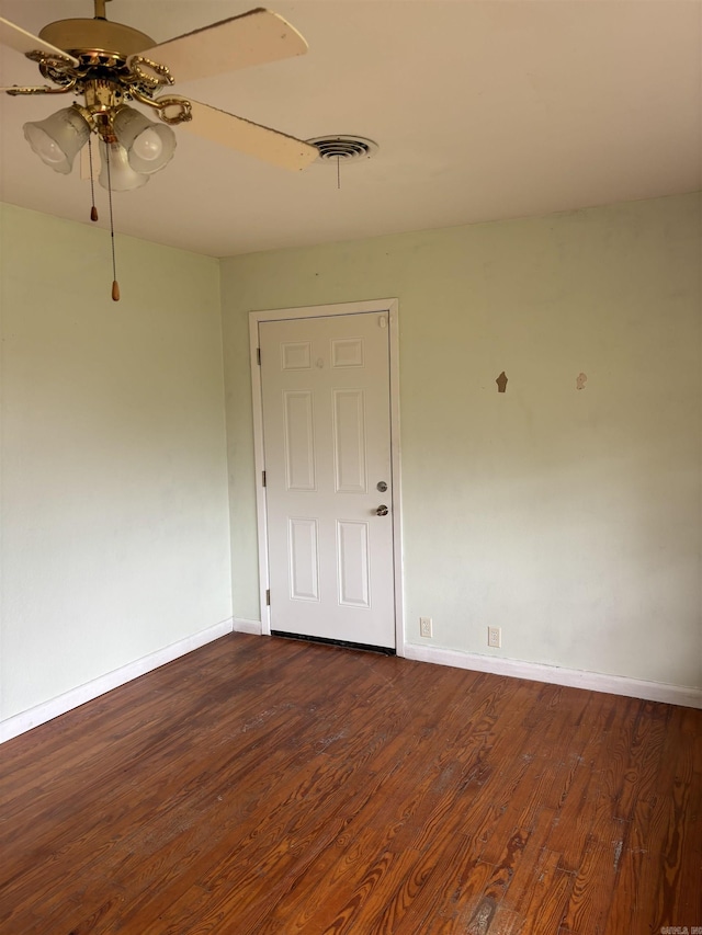 211 Murray, Dierks, AR 71833 - empty room with baseboards, a ceiling fan, and dark wood-type flooring