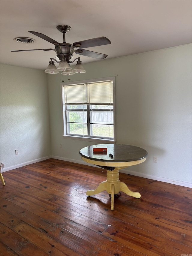 211 Murray, Dierks, AR 71833 - unfurnished dining area with wood-type flooring, ceiling fan, and baseboards