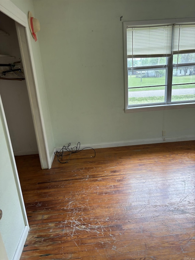 211 Murray, Dierks, AR 71833 - unfurnished bedroom with hardwood / wood-style flooring, baseboards, and a closet