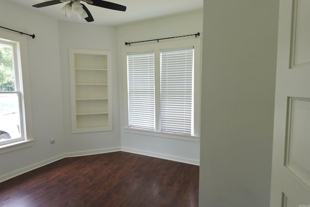 1365 Mitchell St, Conway, AR 72034 - empty room featuring dark wood finished floors, ceiling fan, and baseboards