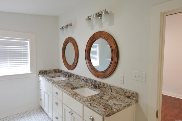 1365 Mitchell St, Conway, AR 72034 - bathroom featuring double vanity and baseboards