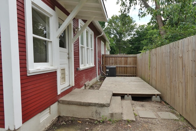 1365 Mitchell St, Conway, AR 72034 - fenced backyard featuring central AC unit and a wooden deck
