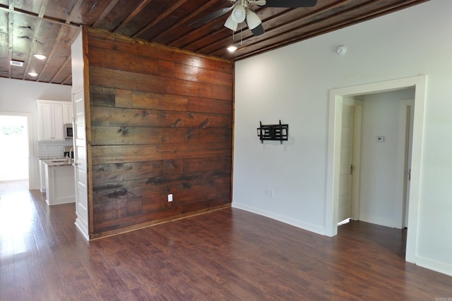 1365 Mitchell St, Conway, AR 72034 - spare room with ceiling fan, dark wood finished floors, baseboards, and wooden ceiling