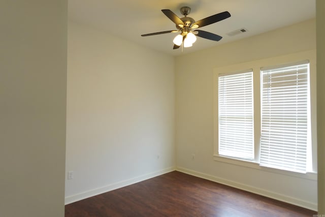 1365 Mitchell St, Conway, AR 72034 - empty room featuring dark wood-type flooring, baseboards, and ceiling fan