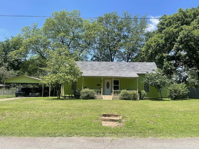 210 Gann St, Mena, AR 71953 - view of front of house featuring covered porch, a front yard, and a carport