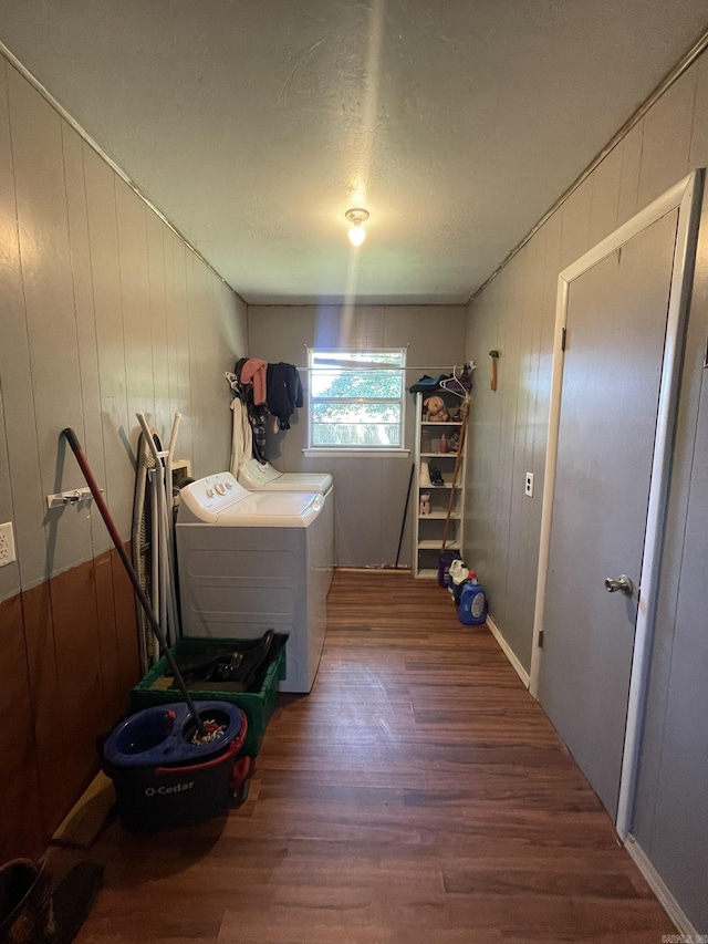 210 Gann St, Mena, AR 71953 - laundry room with washer and dryer, wood finished floors, and wooden walls