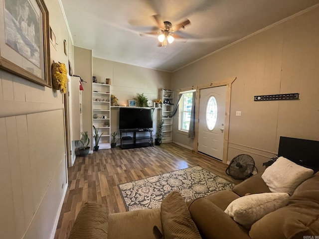 210 Gann St, Mena, AR 71953 - living room featuring a ceiling fan, wood finished floors, lofted ceiling, and ornamental molding
