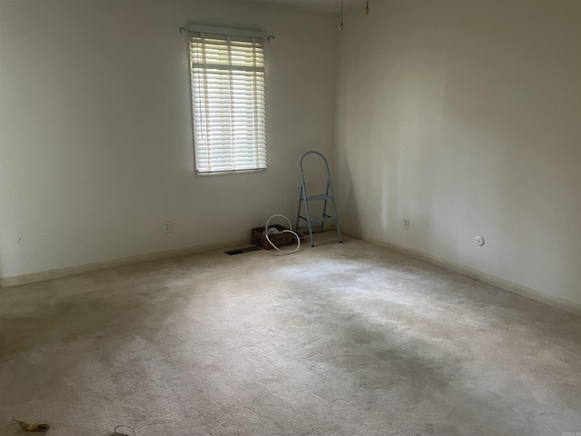 unfurnished room with carpet floors