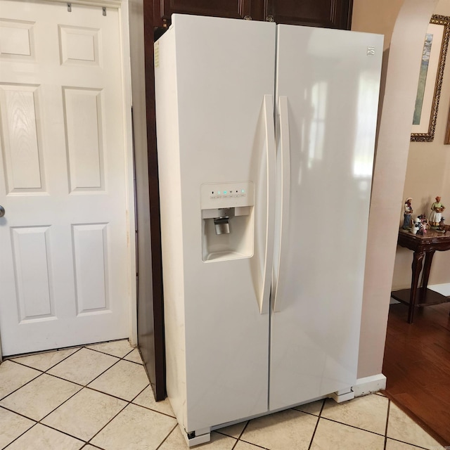 1401 S Schiller, Little Rock, AR 72202 - kitchen view of white fridge with ice dispenser, dark brown cabinetry, and arched walkways