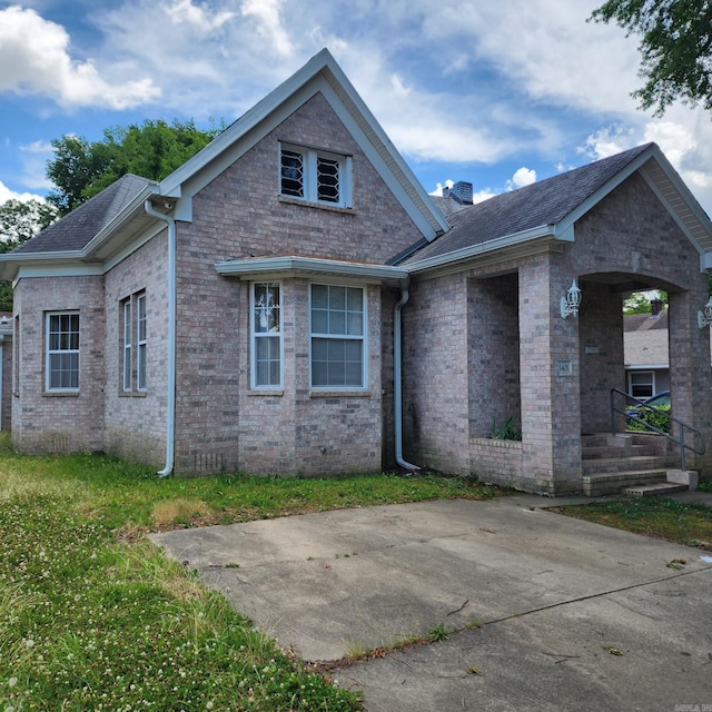 1401 S Schiller, Little Rock, AR 72202 - view of front of home with brick siding, a chimney, and a shingled roof