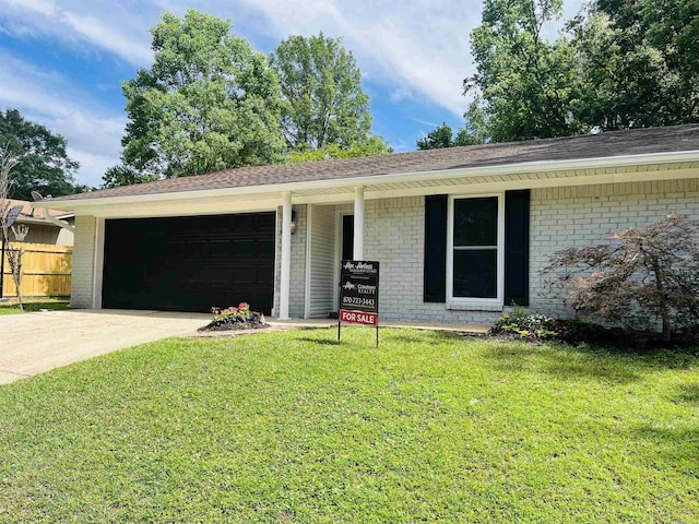 2715 Deer Xing, El Dorado, AR 71730 - ranch-style home with a garage, brick siding, driveway, and roof with shingles
