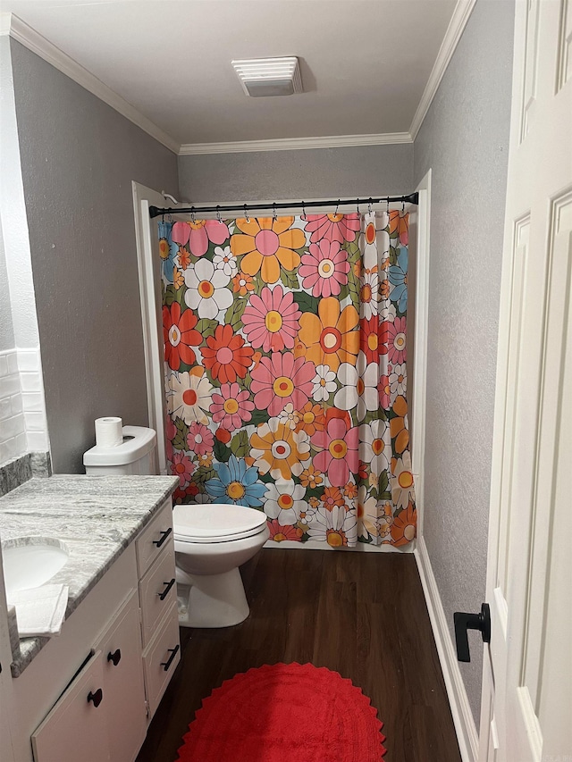 2715 Deer Xing, El Dorado, AR 71730 - full bathroom featuring wood finished floors, vanity, a textured wall, toilet, and ornamental molding