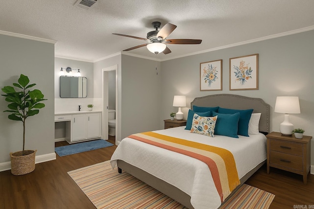 2715 Deer Xing, El Dorado, AR 71730 - bedroom featuring wood finished floors, connected bathroom, ornamental molding, ceiling fan, and baseboards