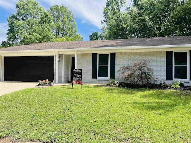 2715 Deer Xing, El Dorado, AR 71730 - ranch-style house featuring brick siding, an attached garage, a front lawn, driveway, and a shingled roof