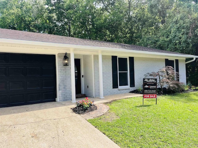 2715 Deer Xing, El Dorado, AR 71730 - ranch-style house with a garage, a front yard, brick siding, and a shingled roof