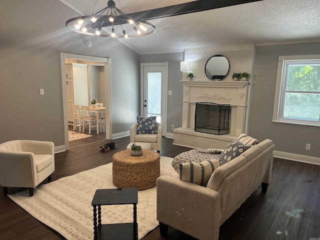 2715 Deer Xing, El Dorado, AR 71730 - living area with a chandelier, wood finished floors, crown molding, a fireplace with raised hearth, and vaulted ceiling