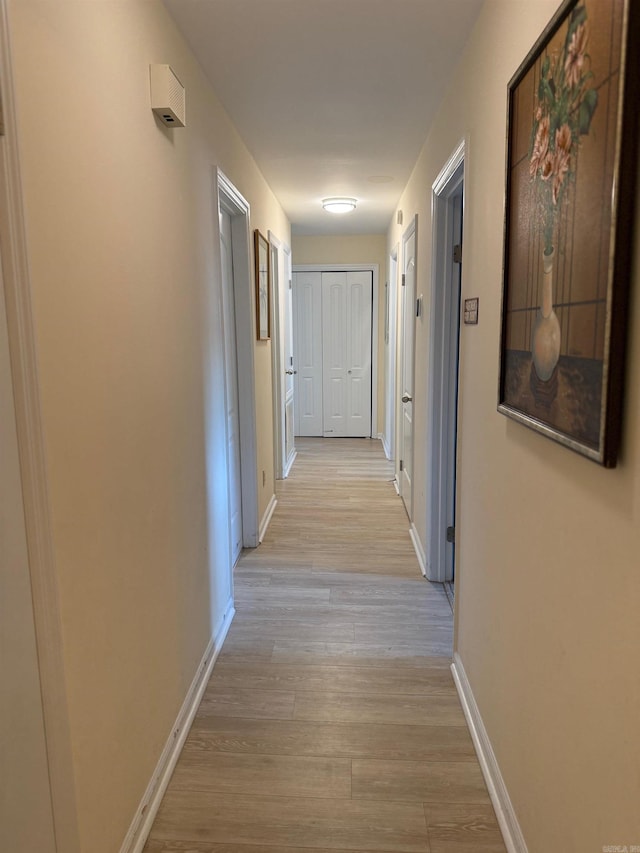 2 Flourite Ct, Little Rock, AR 72212 - corridor with light wood-style flooring and baseboards