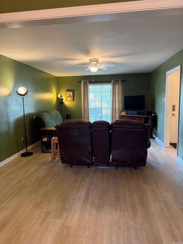 2 Flourite Ct, Little Rock, AR 72212 - living room featuring light wood-style floors, a ceiling fan, and baseboards