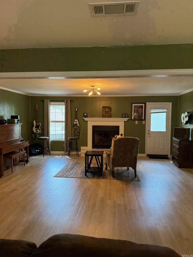2 Flourite Ct, Little Rock, AR 72212 - living room featuring ornamental molding, wood finished floors, and a fireplace