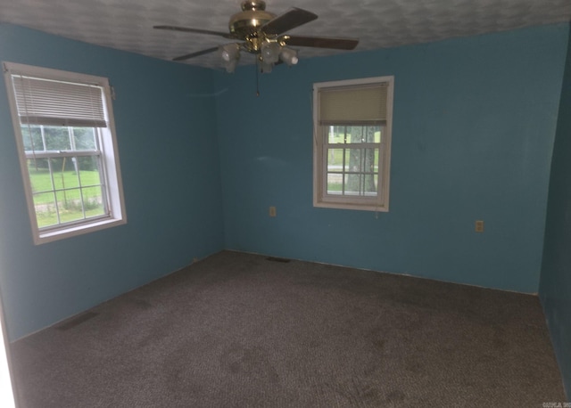 1851 W Clay, Piggott, AR 72454 - empty room with a ceiling fan and carpet