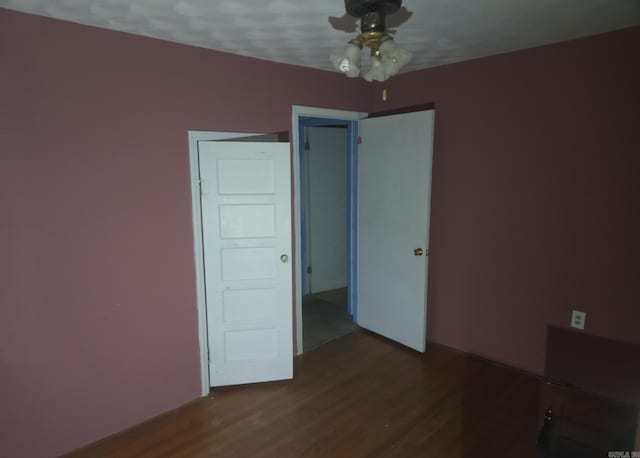 1851 W Clay, Piggott, AR 72454 - spare room featuring dark wood-type flooring and a ceiling fan