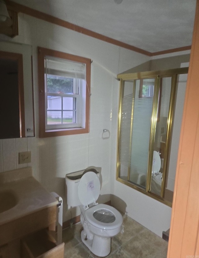 1851 W Clay, Piggott, AR 72454 - full bathroom featuring toilet, combined bath / shower with glass door, vanity, and crown molding