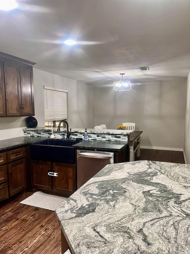 88 Cobblestone Rd, Plumerville, AR 72127 - kitchen featuring stainless steel dishwasher, dark wood-style flooring, dark stone countertops, a peninsula, and dark brown cabinets