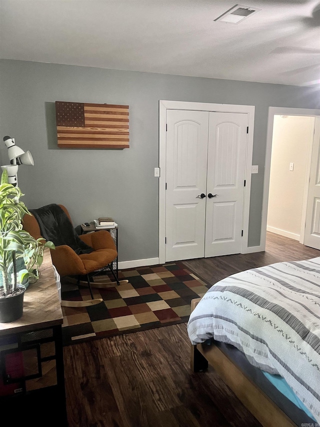 88 Cobblestone Rd, Plumerville, AR 72127 - bedroom with dark wood-style flooring, baseboards, and a closet