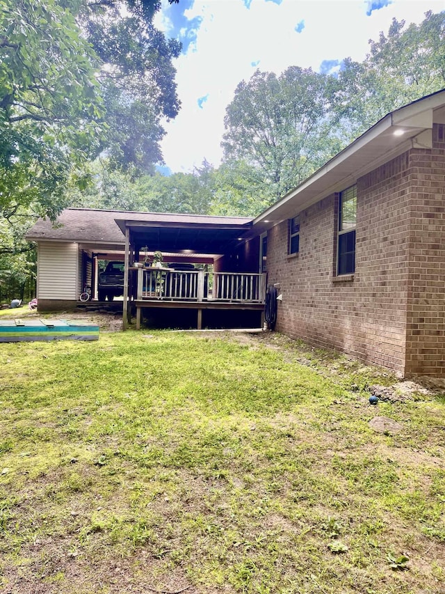 88 Cobblestone Rd, Plumerville, AR 72127 - back of house with a yard, a deck, and brick siding