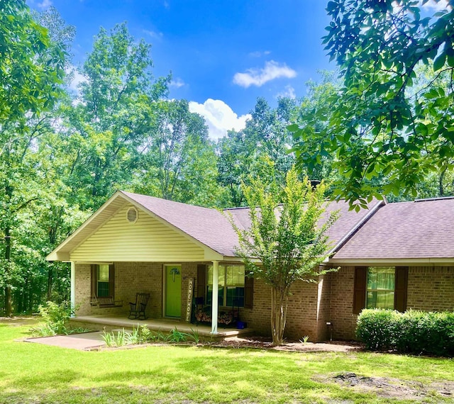 88 Cobblestone Rd, Plumerville, AR 72127 - ranch-style house featuring a front yard, brick siding, a porch, and roof with shingles